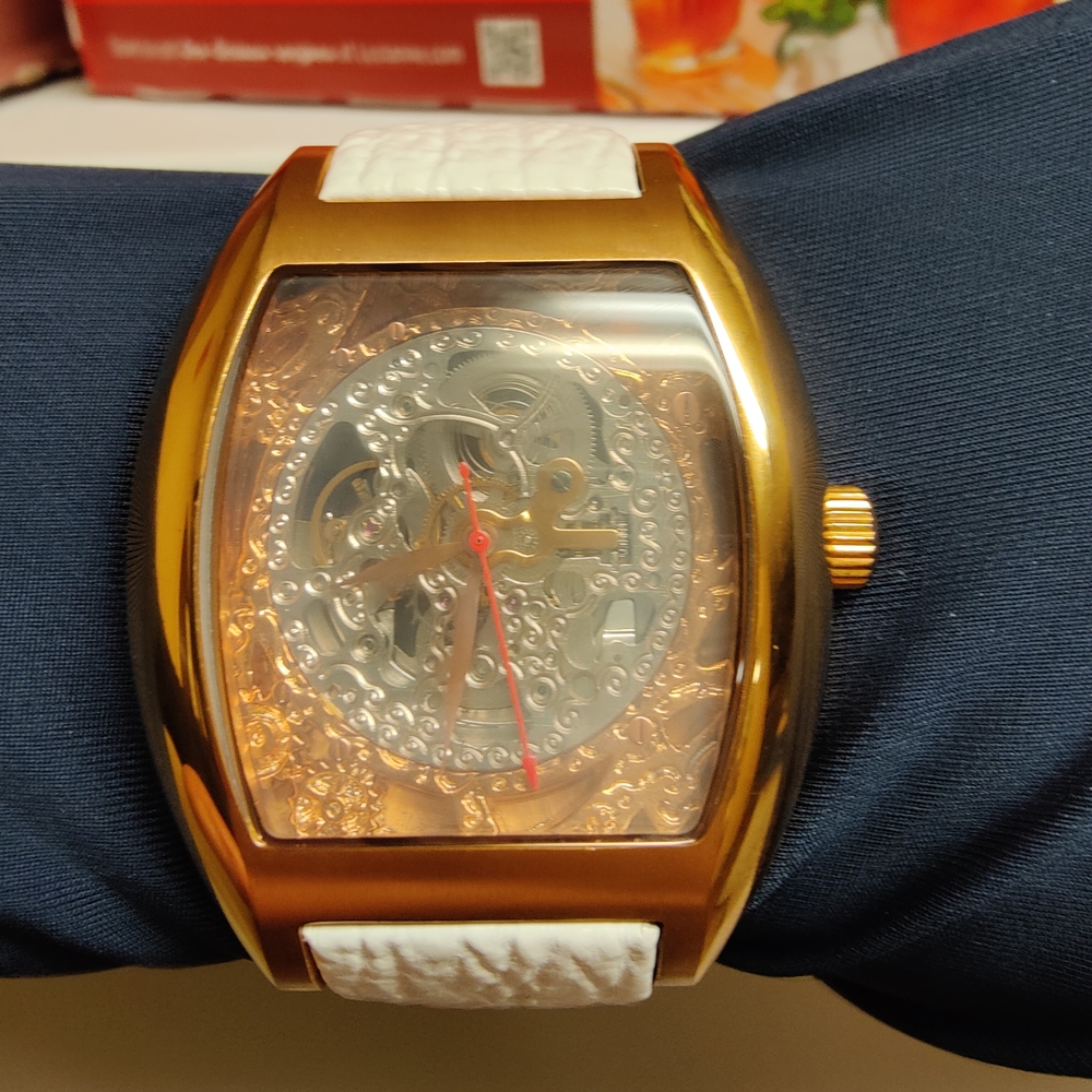 Gold and White Skeleton Watch